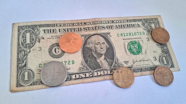 istock US Dollar Bills and Brazilian Coins 2228355939