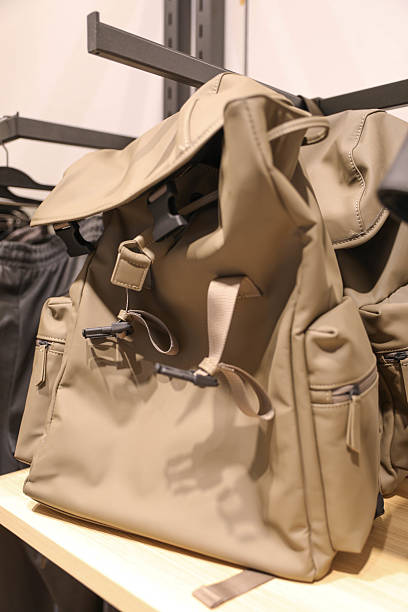 istock Modern Beige Backpack Displayed On Wooden Shelf In Store 2228358474