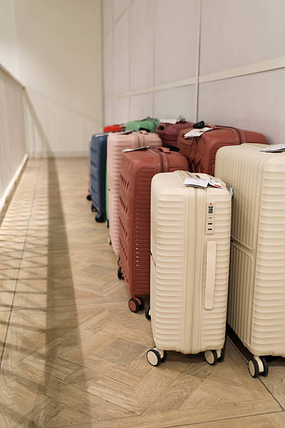 istock Colorful Suitcases Lined Up In Retail Store Aisle 2228358492
