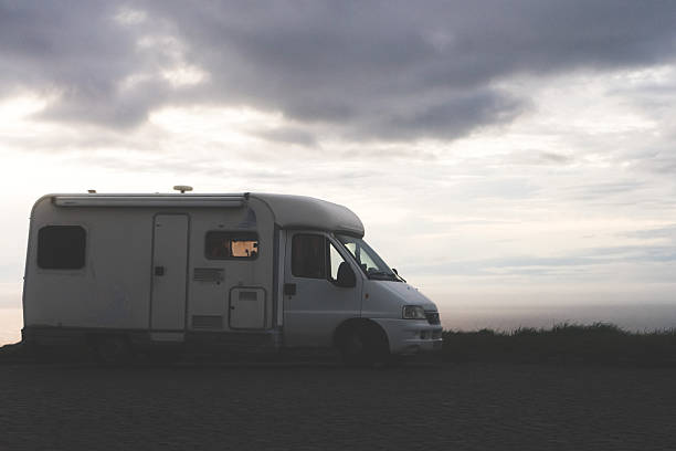 istock Silhouette of a camper van against a twilight sky. 2228361807