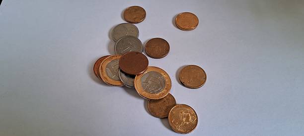 istock Brazilian real coins on white background 2228362016