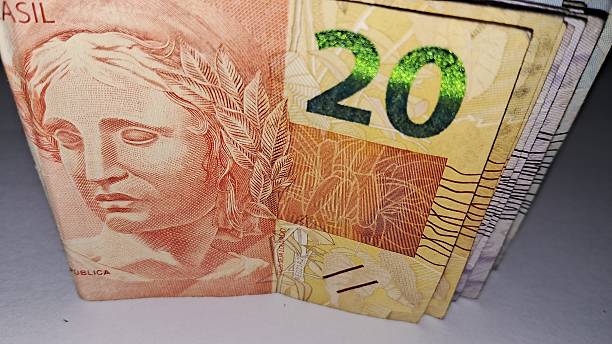 istock Brazilian real notes folded in half on a white background 2228362466