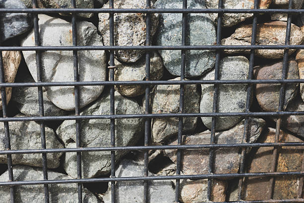 istock Gabion Wall with Natural Stones and Concrete Structure 2228363566