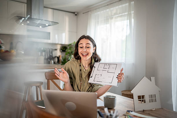 istock Architect presenting a project of a new house during a video call 2228364994