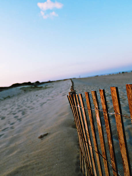 istock Wooden Fence Sand Dunes 2228368671