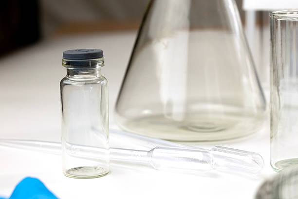 istock Laboratory scene with glassware including a flask, a vial, and a pipette. 2228373250
