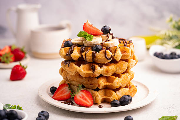 istock Tasty Belgian waffles with fresh berries 2228376357