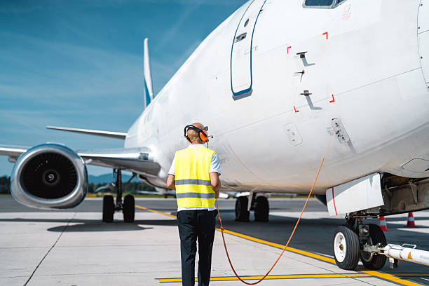 istock Cargo Aircraft Systems Check by Hispanic Ground Operations Crew Member 2228382983