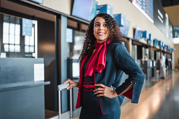 istock Young Hispanic Stevardese Arriving at Airport with Confidence 2228383338