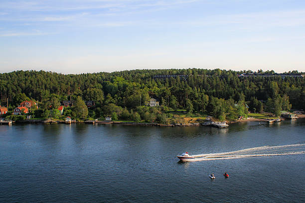 Homes along the coast of the Stockholm Archipelago, an island chain,  which is the largest archipelago in Sweden, and the second-largest archipelago in the Baltic Sea. The region is popular amongst inhabitants of Stockholm for owning vacation homes.