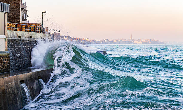 istock An impressive wave breaks over the sea wall in Saint-Malo 2228386933