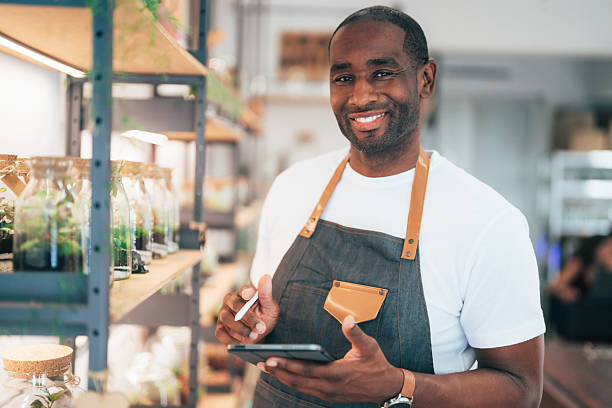 istock Young business owner checking inventory on store shelves using a digital tablet 2228387110