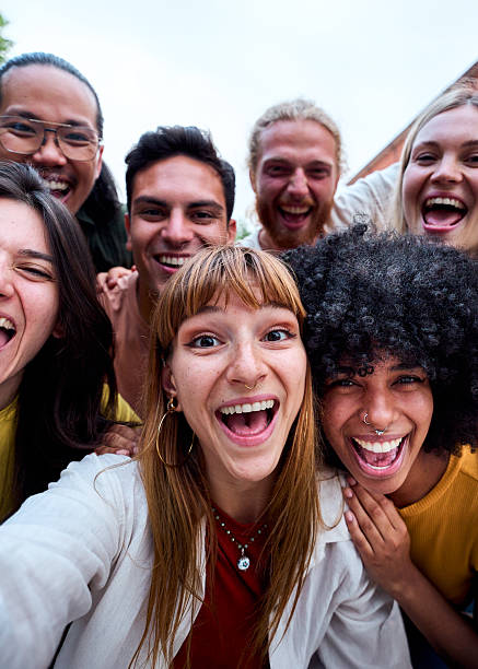 istock Happy young students celebrating success with arms raised and screaming 2228387190