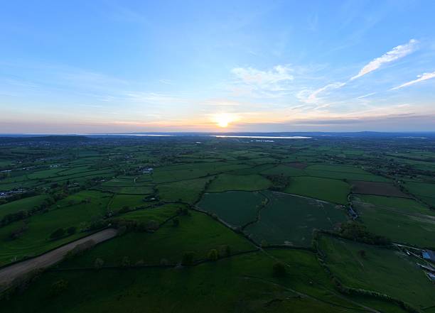 istock Aerial view of green fields at sunset. 2228390352