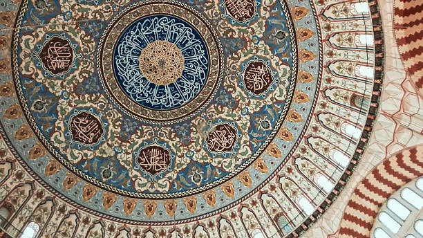 istock Detailed Islamic Calligraphy on Mosque Dome 2228392029