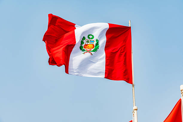 istock Waving Peruvian flag on sunny day, Lurigancho District - Lima 2228392181