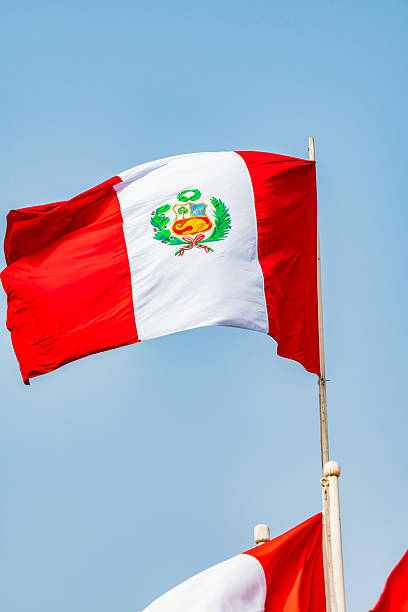 istock Waving Peruvian flags on sunny day, Lurigancho District - Lima 2228392185