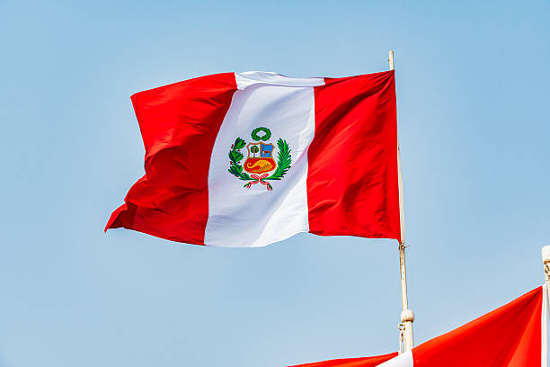 istock Waving Peruvian flag on sunny day, Lurigancho District - Lima 2228392186