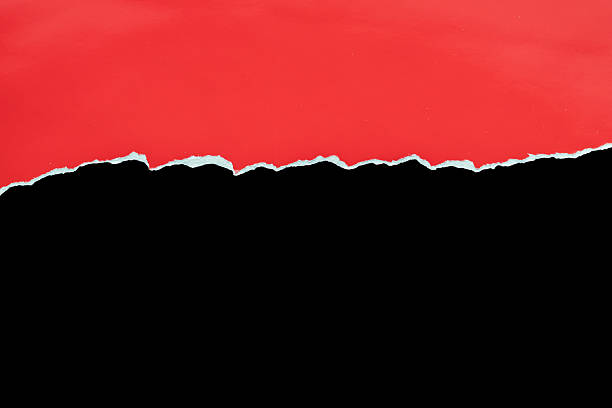 istock Red ripped paper torn edges strips isolated on black background 2228395273