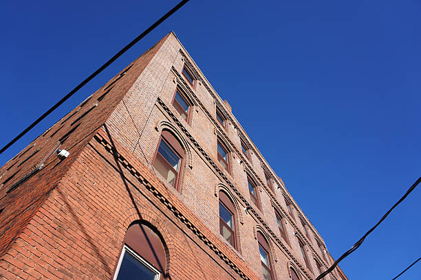 istock low angle view of old building under blue sky 2228395441