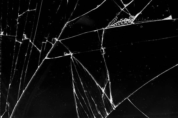 istock cracked glass isolated in black background 2228395526