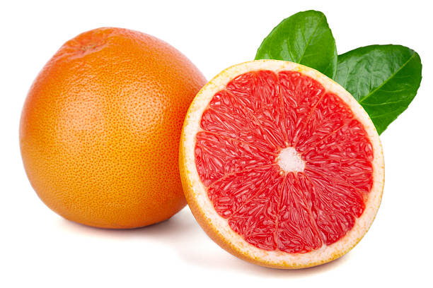 istock Grapefruit with slice and leaves isolated on white background 2228399841