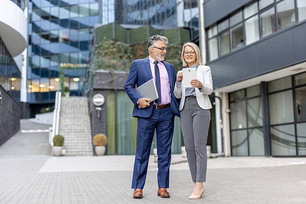 istock Dynamic Business Exchange in Front of Corporate Building 2228400082