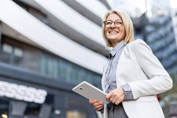 istock Professional woman exudes positivity using her tablet outdoors. 2228400088