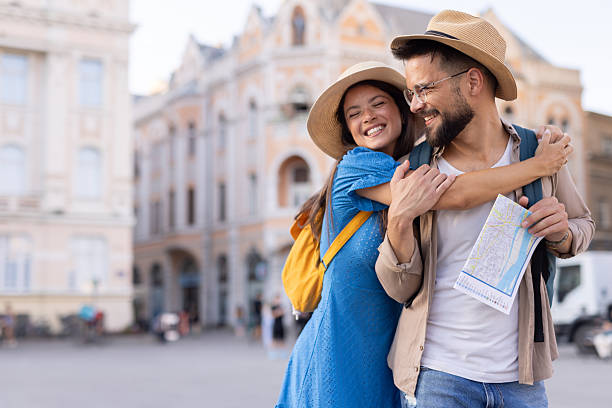 istock Laughing couple enjoying cityscape on a bright sunny day 2228400092