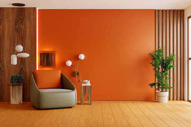 istock Modern cozy reading corner with orange wall and wood elements- 3D rendering 2228401749