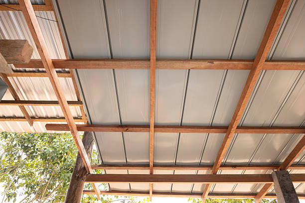 istock Roof under construction with metal sheet and wood structure. 2228405542