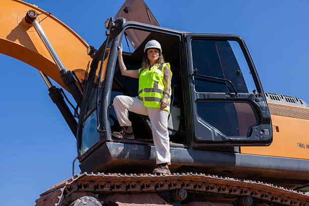 istock Woman operating an excavator at a construction 2228408386
