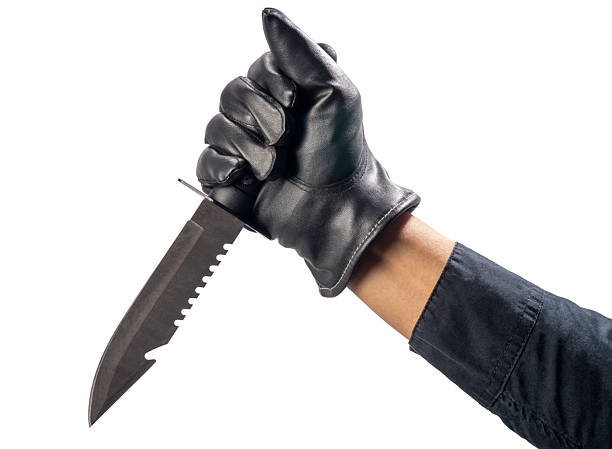 istock Close up Murderer or Criminal Hand holding a knife isolated on white background, Hand Holding knife on White Background 2228408417
