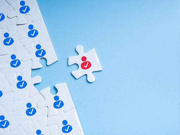 istock Human resources (HR), recruitment, partnership, team building, hiring concept. The red man icon as a right person on last white jigsaw puzzle piece, isolated on blue background with copy space. 2228409241