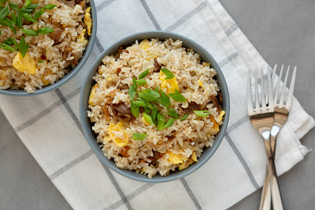 istock Homemade Fried Rice with Bacon and Egg in a Bowl, top view. Flat lay, overhead, from above. 2228427421
