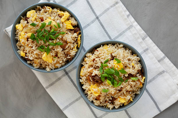 istock Homemade Fried Rice with Bacon and Egg in a Bowl, top view. Flat lay, overhead, from above. 2228427430