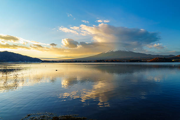 istock Sunrise Symphony: Reflection of Mount Fuji with Glowing Cloud on Lake Surface 2228427669