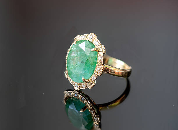 istock 18k gold emerald and diamonds ring 2228432679