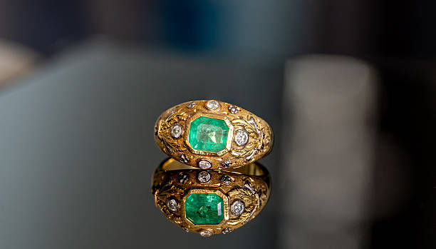 istock 18k gold diamonds and emerald ring 2228432762