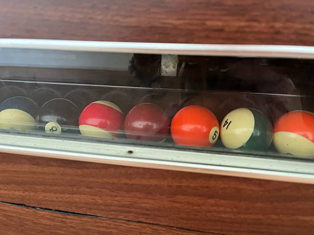 istock Billiard balls in a plastic box on a wooden table close up 2228435236
