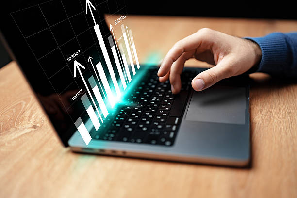 istock Business professional analyzing growth trends using a laptop during evening hours in a modern workspace 2228438867