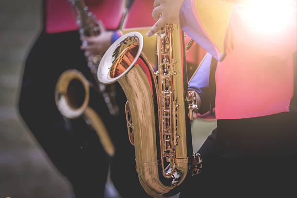 istock Musical instruments in a marching band, saxophone playing hands, saxophone playing jazz. Alto saxophone, musical instrument, close-up. 2228442780