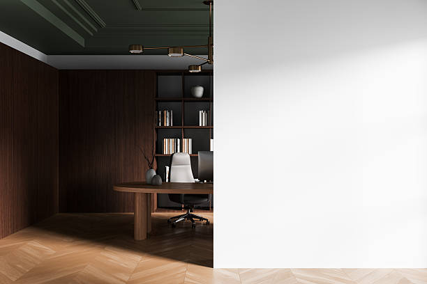 istock Modern interior workspace with dark wood decor and blank white wall for poster mockup or design template presentation concept display. 3D Rendering 2228443420
