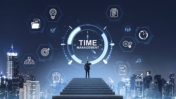 istock Businessman standing on stairs looking at digital clock with tim 2228443505