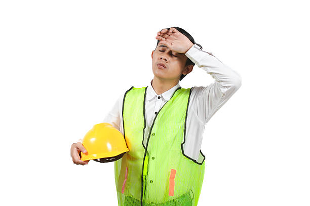 istock portrait of construction worker holding project helmet tired isolated white background 2228444868