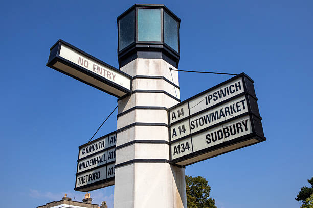 Signposts in the town of Bury St. Edmunds, Suffolk, showing the direction to other local towns and areas - Stowmarket, Sudbury, Ipswich, Yarmouth, Mildenhall and Thetford.