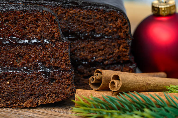 istock Christmas gingerbread cake layered with jam and chocolate icing 2228445535