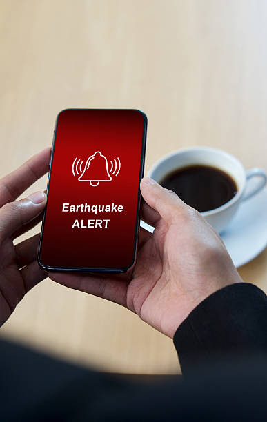 istock Earthquake alert warning displayed on smartphone screen as symbol, telling people to be careful. Technology concept 2228446855