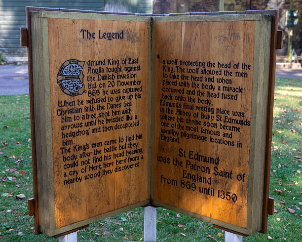 Suffolk, UK - September 6th 2024: A sculpture in the Abbey Gardens in Bury St. Edmunds, Suffolk, UK, detailing the story of the legend of Saint Edmunds and the Wolf.