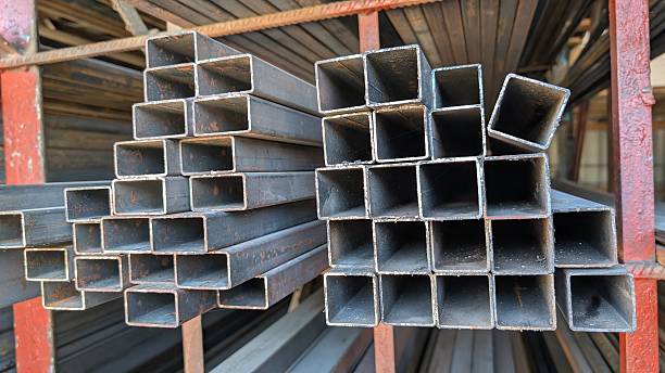 istock Stacked Steel Pipes in an Industrial Setting showcasing robust steel elements in assembly 2228449879
